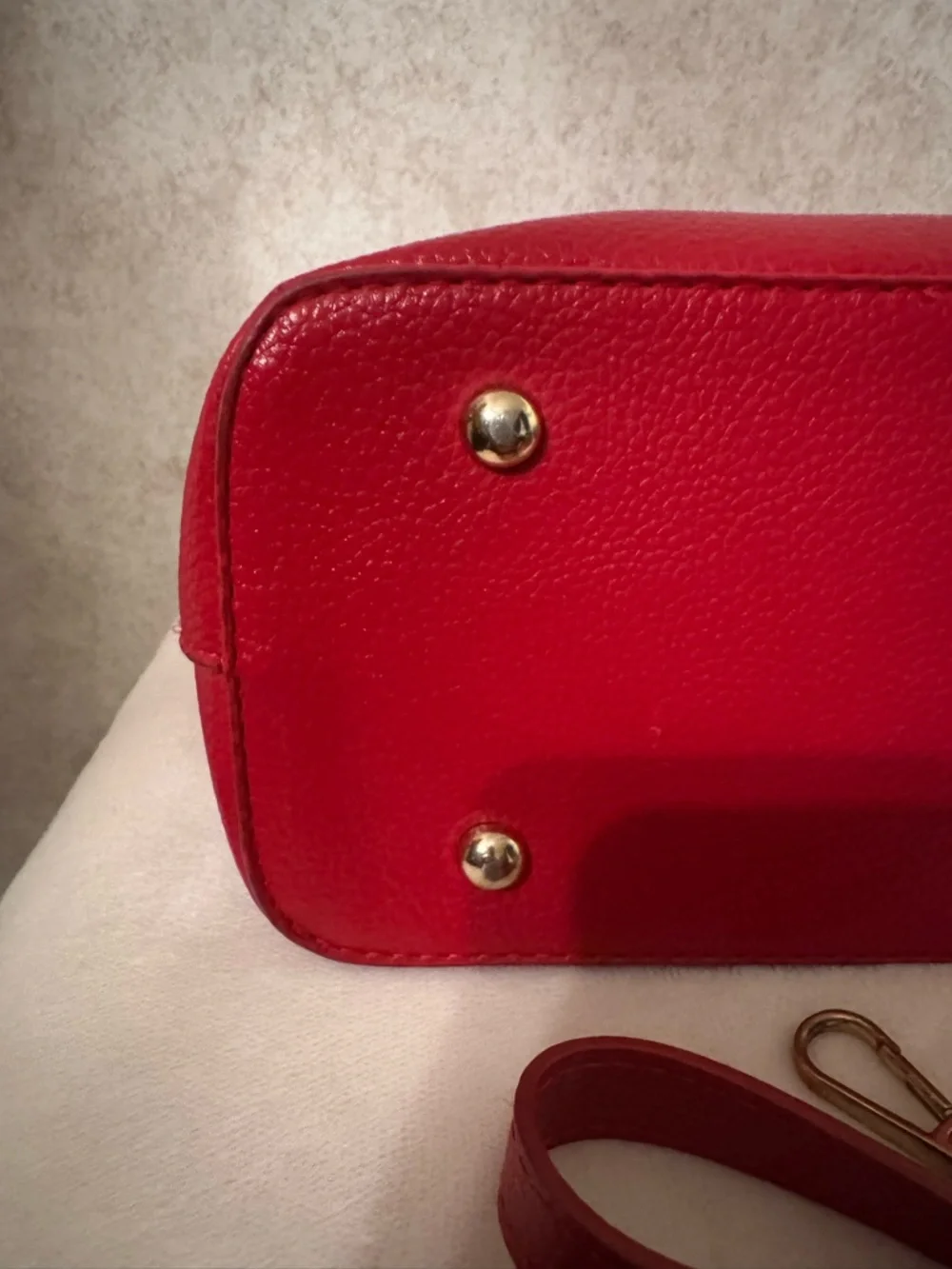 bebe Red Pebbled Fabiola Leather Satchel with Gold Logo Accent with strap.